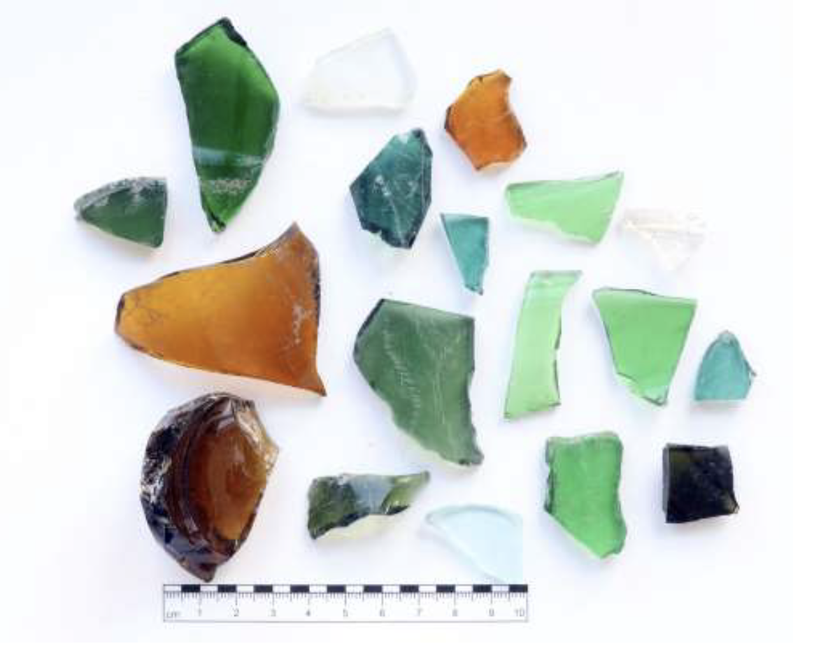 Archaeological artifacts and glass fragments discovered during the 2023 excavation at the Rossau camp site